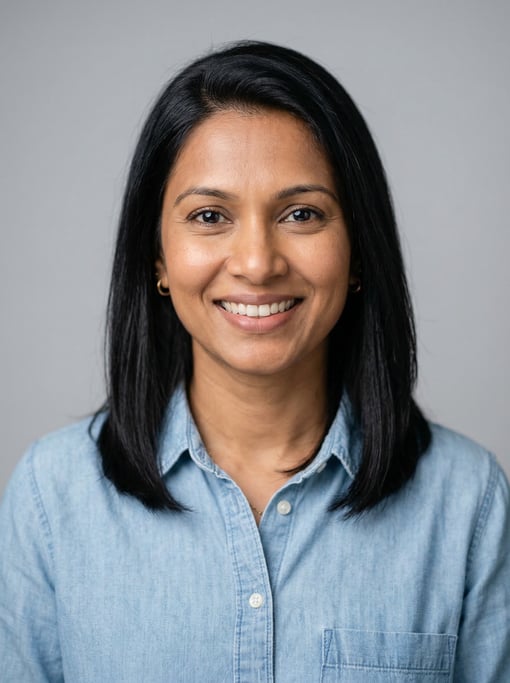 Professional studio headshot of a 39-year-old Sri Lankan woman with shoulder-length straight black h