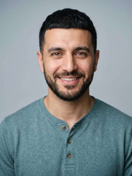 Professional studio headshot of a 32-year-old Middle Eastern man with a Caesar cut in black