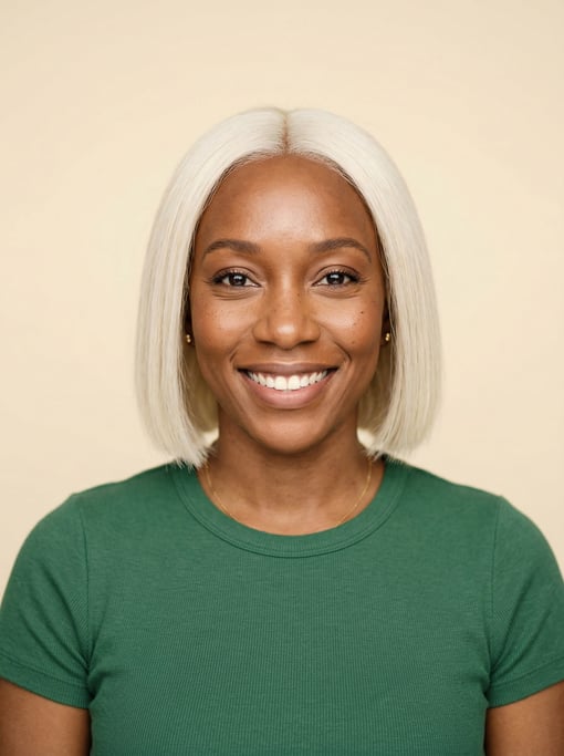 Professional studio headshot of a 35-year-old Jamaican woman with a blunt bob in platinum blonde