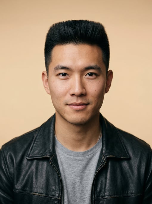 Professional studio headshot of a 26-year-old Chinese man with a flat top in black