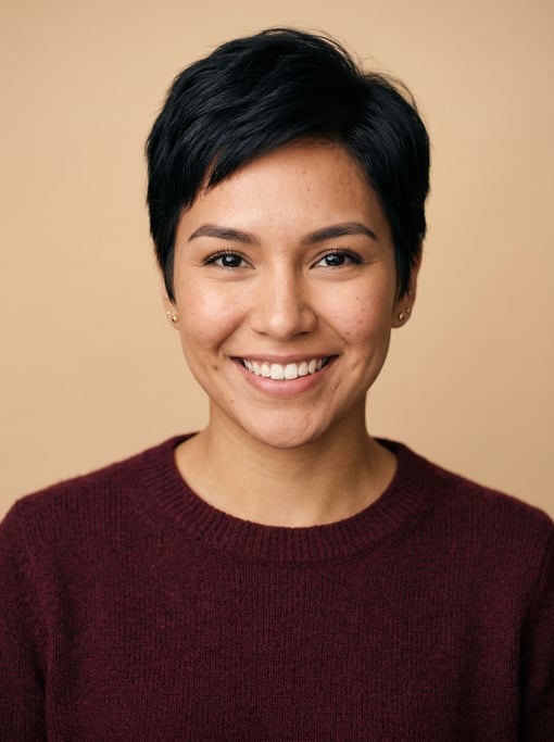 Professional studio headshot of a 24-year-old Native American woman with a short pixie cut in black
