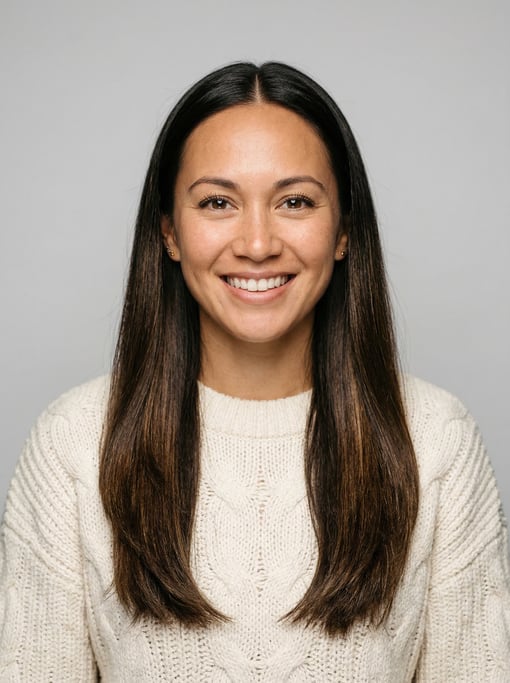 Professional studio headshot of a 30-year-old Hawaiian woman with long straight dark brown hair with