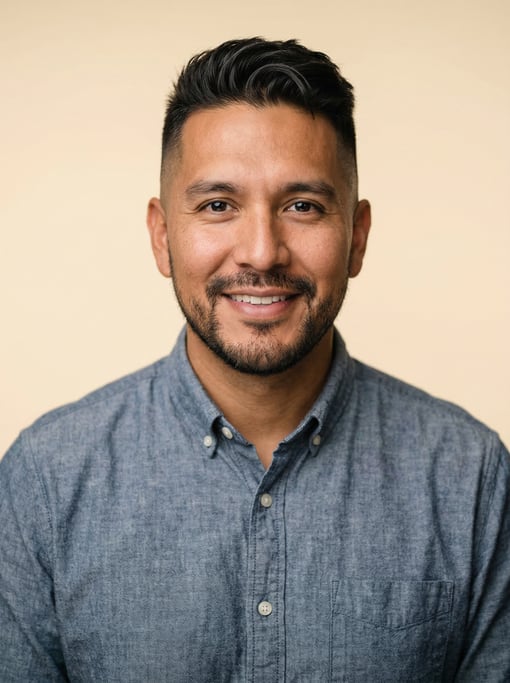 Professional studio headshot of a 37-year-old Native American man with a mid fade with textured top