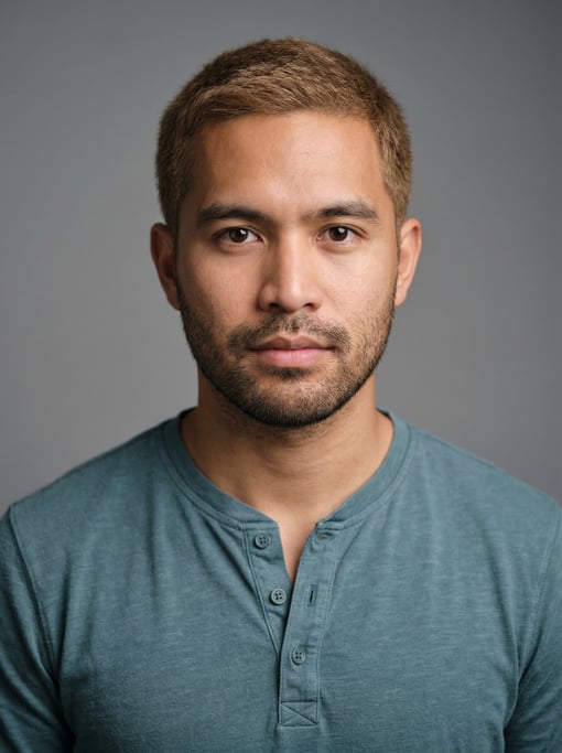 Professional studio headshot of a 26-year-old Filipino man with short cropped sandy brown hair