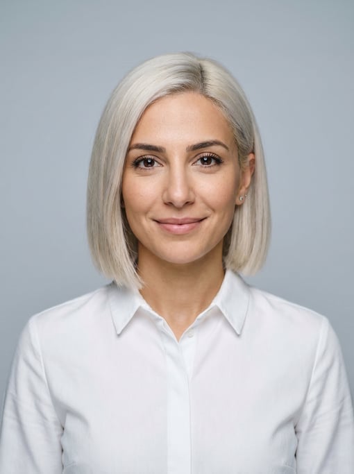 Professional studio headshot of a 36-year-old Lebanese woman with a blunt bob in platinum blonde