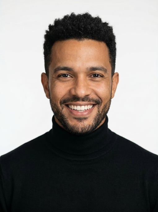Professional studio headshot of a 34-year-old Brazilian man with a black textured crop