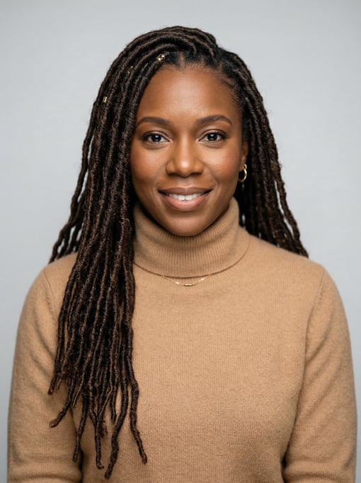 Professional studio headshot of a 37-year-old Black American woman with long goddess locs in dark br