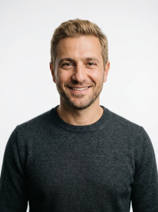 Professional studio headshot of a 40-year-old Lebanese man with short dirty blonde hair