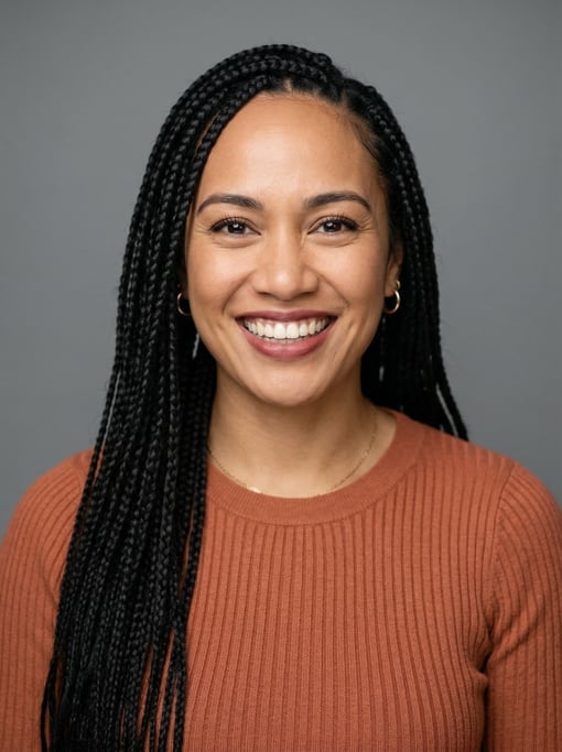 Professional studio headshot of a 30-year-old Polynesian woman with long box braids in black