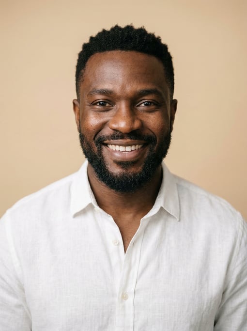 Professional studio headshot of a 37-year-old Nigerian man with a black textured crop