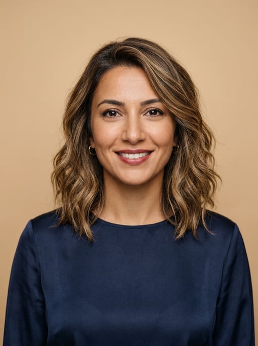 Professional studio headshot of a 38-year-old Turkish woman with a textured lob with balayage highli
