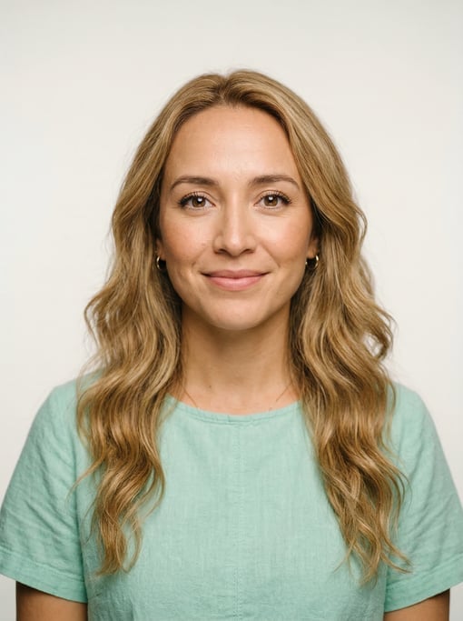 Professional studio headshot of a 30-year-old Mexican woman with long wavy honey blonde hair