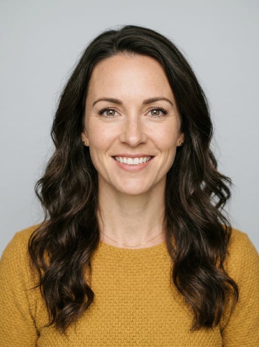 Professional studio headshot of a 36-year-old White Nordic woman with long wavy dark brown hair