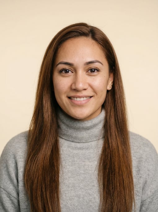 Professional studio headshot of a 24-year-old Polynesian woman with long straight chestnut hair