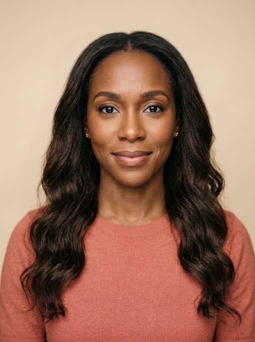 Professional studio headshot of a 38-year-old Jamaican woman with long wavy dark brown hair