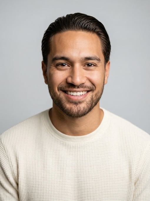Professional studio headshot of a 25-year-old Polynesian man with a slicked-back style in dark brown