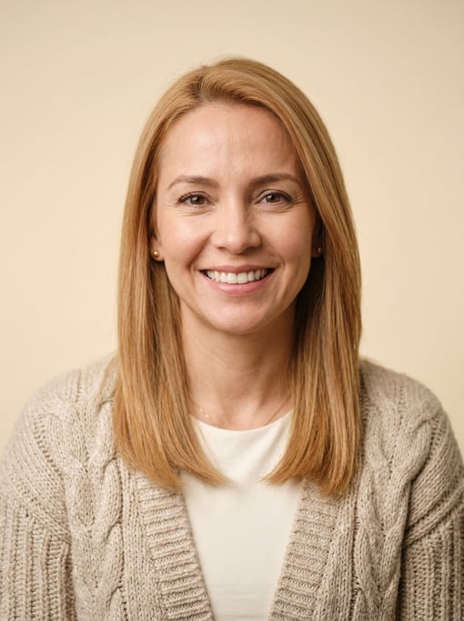 Professional studio headshot of a 40-year-old Colombian woman with fine straight strawberry blonde h