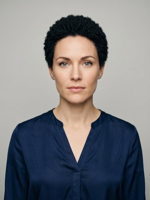 Professional studio headshot of a 30-year-old White Nordic woman with a short TWA hairstyle in black