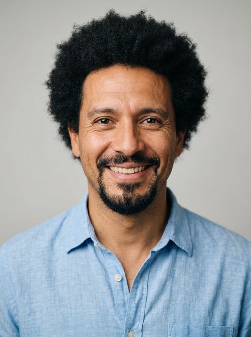 Professional studio headshot of a 40-year-old Argentinian man with a medium natural afro in black