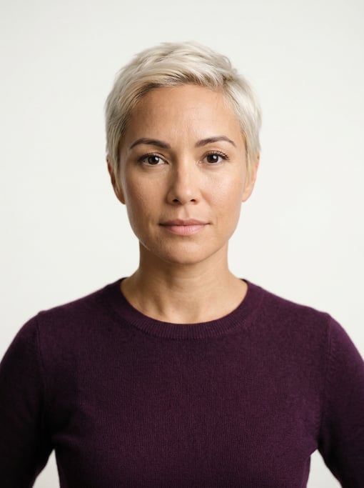 Professional studio headshot of a 38-year-old Hawaiian woman with a short pixie cut in platinum blon