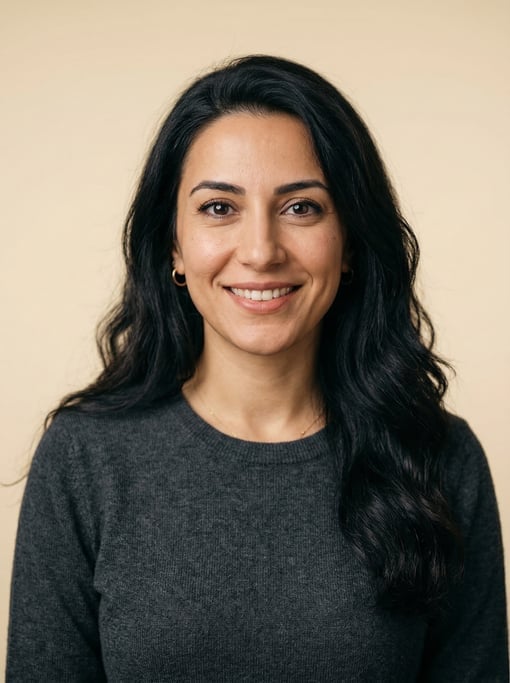 Professional studio headshot of a 30-year-old Turkish woman with long wavy black hair