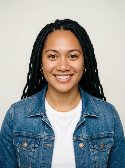 Professional studio headshot of a 25-year-old Polynesian woman with long faux locs in black