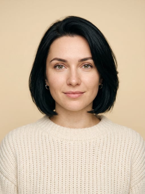 Professional studio headshot of a 25-year-old White Eastern European woman with a chin-length bob in