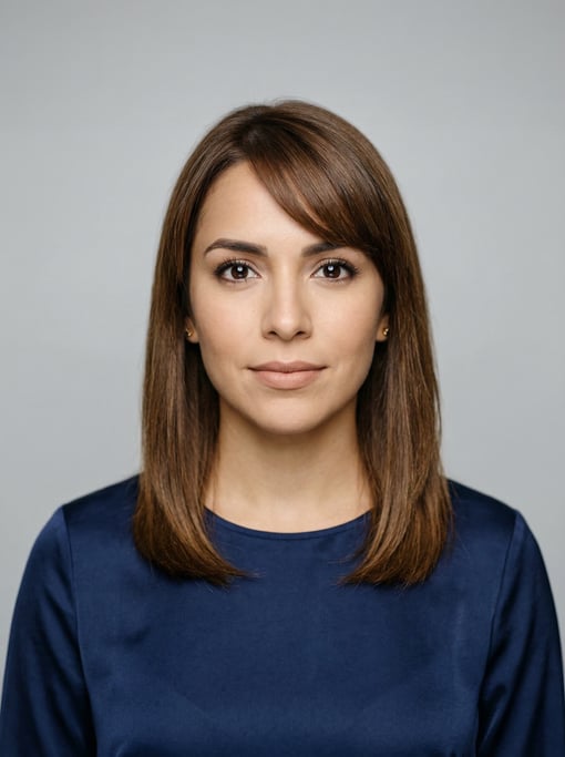 Professional studio headshot of a 28-year-old Latina woman with shoulder-length straight brown hair