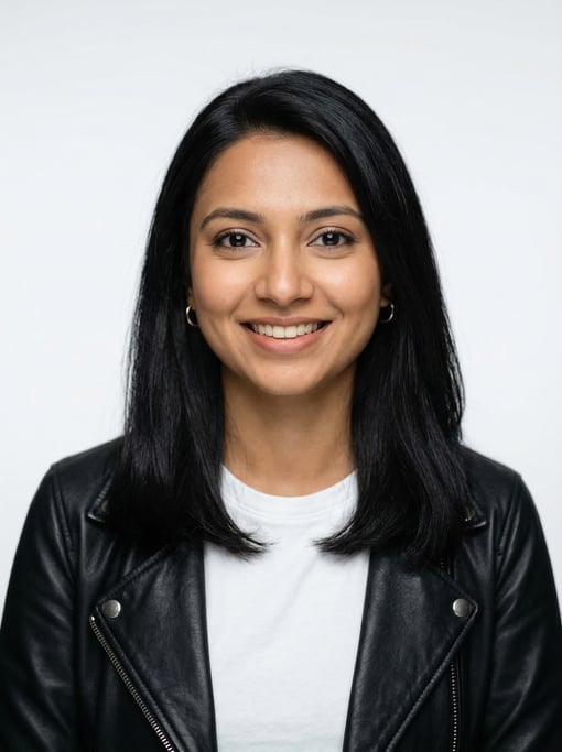 Professional studio headshot of a 25-year-old Bengali woman with shoulder-length straight black hair