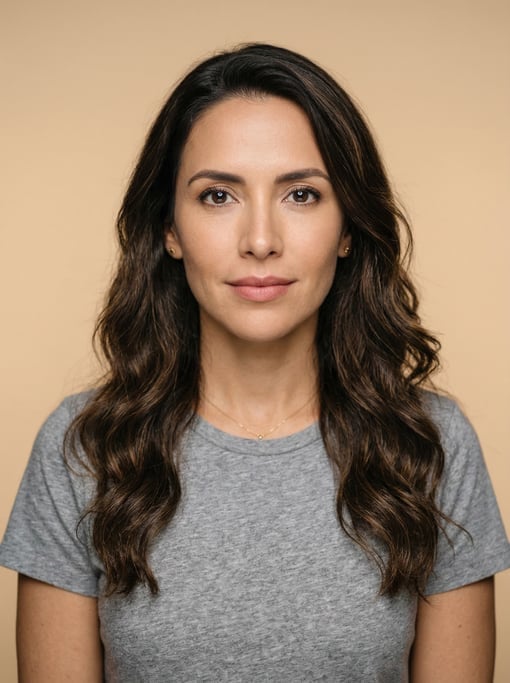 Professional studio headshot of a 36-year-old Colombian woman with long wavy dark brown hair