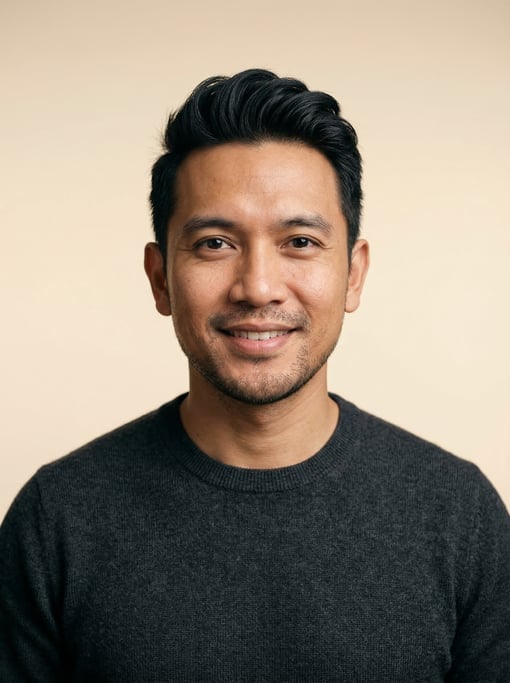 Professional studio headshot of a 36-year-old Indonesian man with a quiff in black