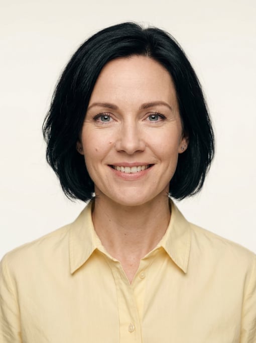 Professional studio headshot of a 40-year-old White Nordic woman with a chin-length bob in jet black