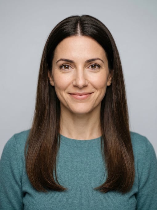 Professional studio headshot of a 39-year-old White Mediterranean woman with long straight dark brow