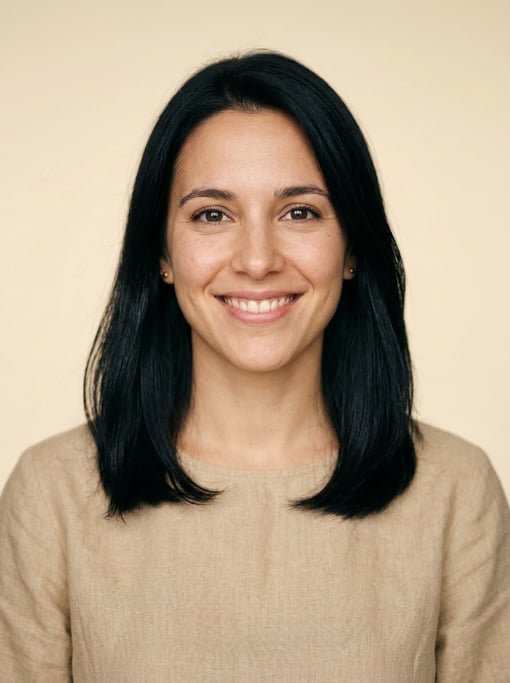 Professional studio headshot of a 26-year-old Argentinian woman with shoulder-length straight black