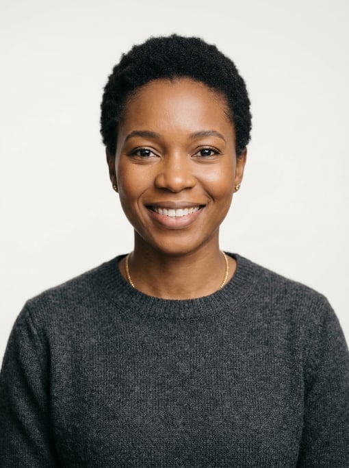 Professional studio headshot of a 31-year-old Nigerian woman with a short TWA hairstyle in black