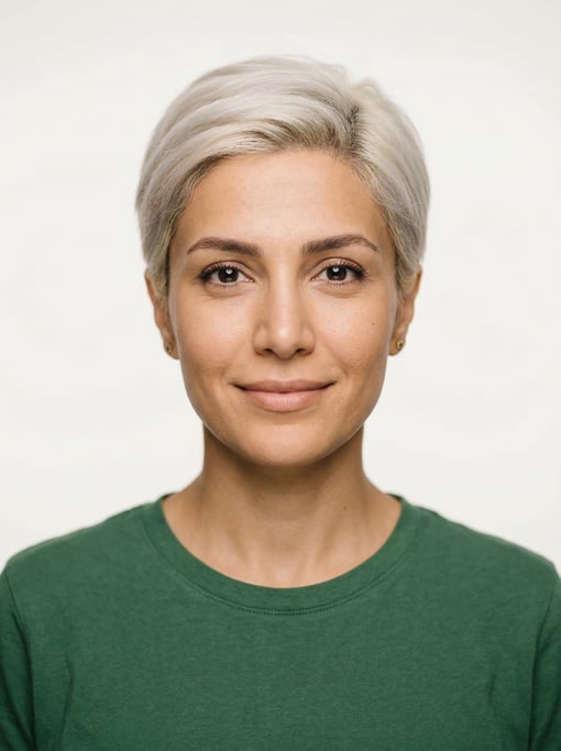 Professional studio headshot of a 35-year-old Persian woman with a short pixie cut in platinum blond