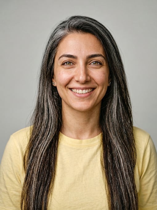 Professional studio headshot of a 30-year-old Persian woman with long straight silver-streaked dark