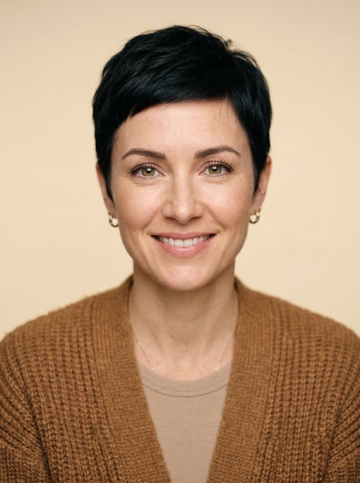 Professional studio headshot of a 35-year-old White European woman with a short pixie cut in black