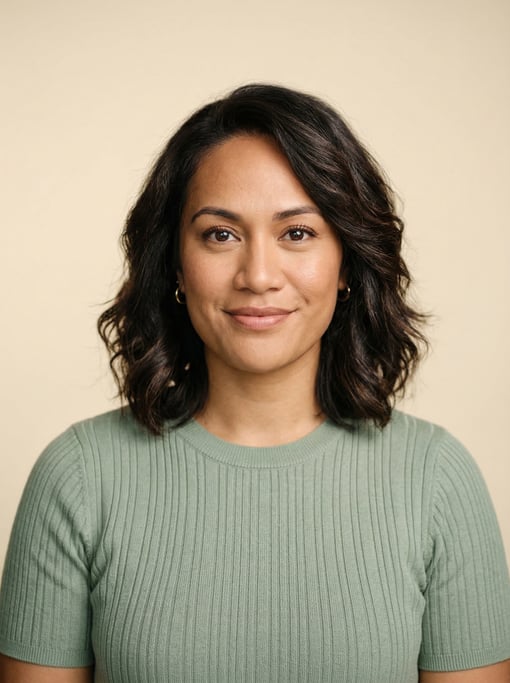 Professional studio headshot of a 34-year-old Pacific Islander woman with a textured lob in dark bro
