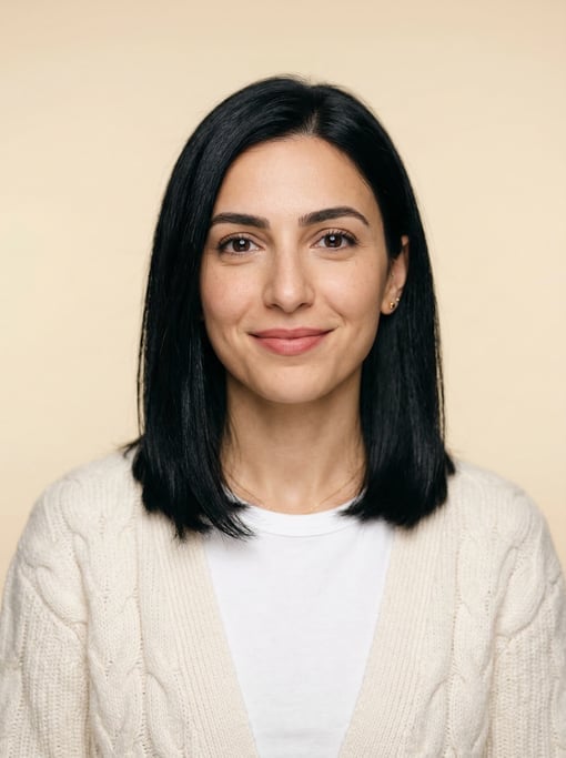 Professional studio headshot of a 27-year-old Lebanese woman with shoulder-length straight black hai