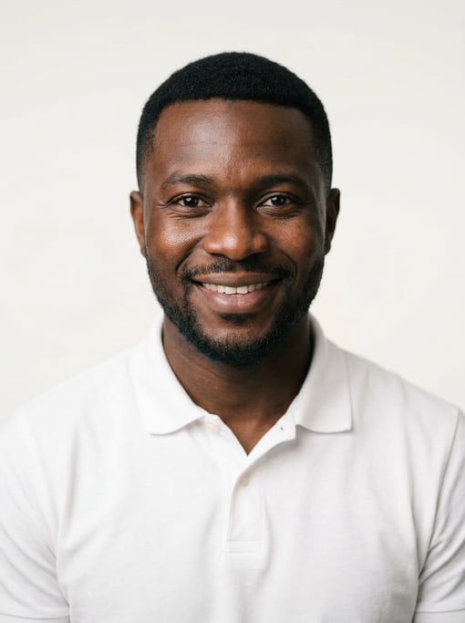 Professional studio headshot of a 31-year-old West African man with a Caesar cut in black