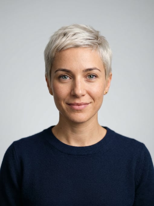 Professional studio headshot of a 30-year-old White Mediterranean woman with a short pixie cut in pl