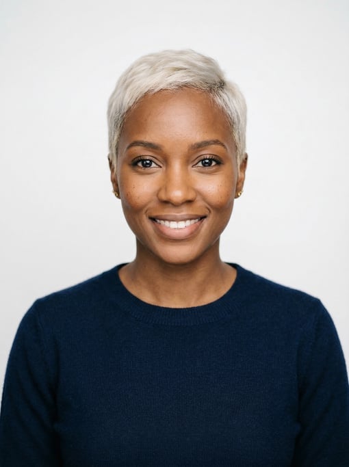 Professional studio headshot of a 30-year-old East African woman with a short pixie cut in platinum