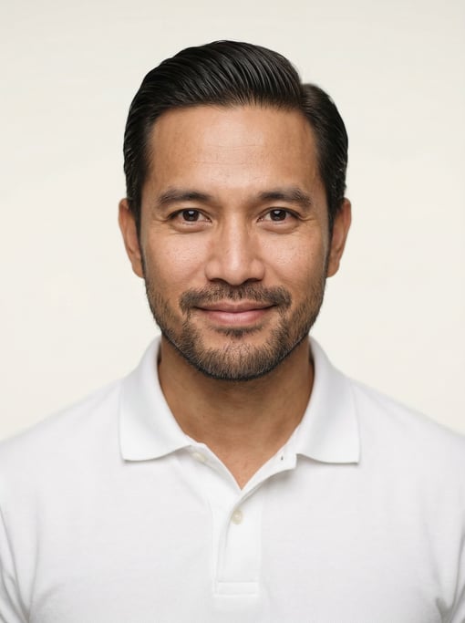 Professional studio headshot of a 38-year-old Thai man with a slicked-back style in dark brown