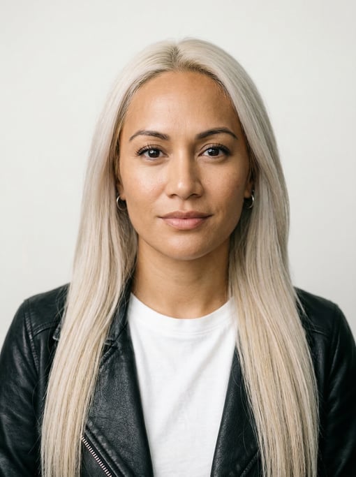 Professional studio headshot of a 33-year-old Polynesian woman with long straight platinum blonde ha