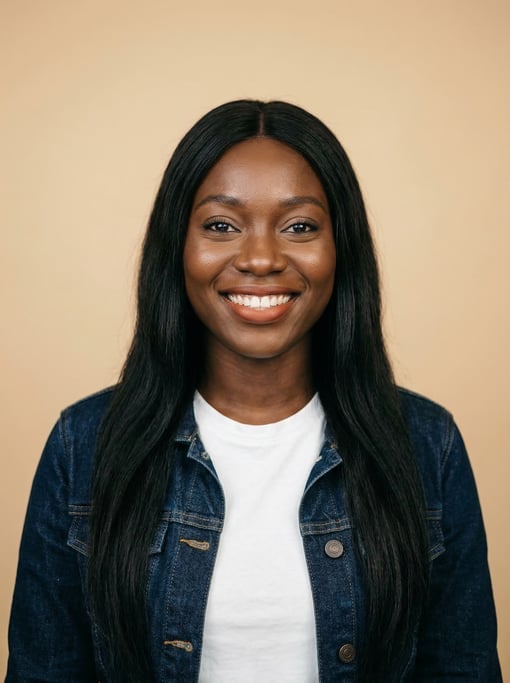 Professional studio headshot of a 26-year-old Ghanaian woman with long straight black hair falling p