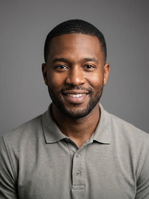 Professional studio headshot of a 33-year-old Black American man with short cropped black hair