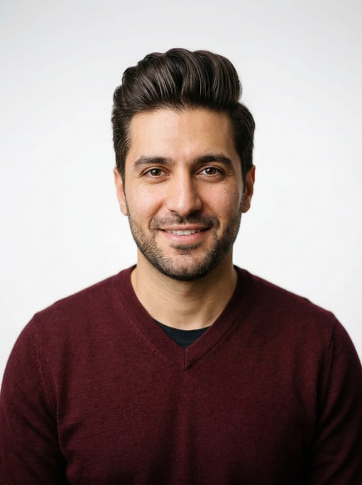 Professional studio headshot of a 32-year-old Persian man with a pompadour in dark brown