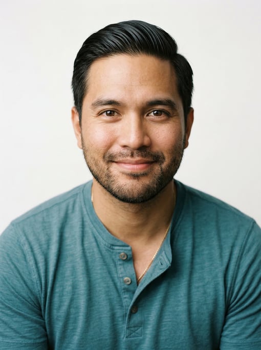 Professional studio headshot of a 33-year-old Filipino man with a slicked-back style in dark brown