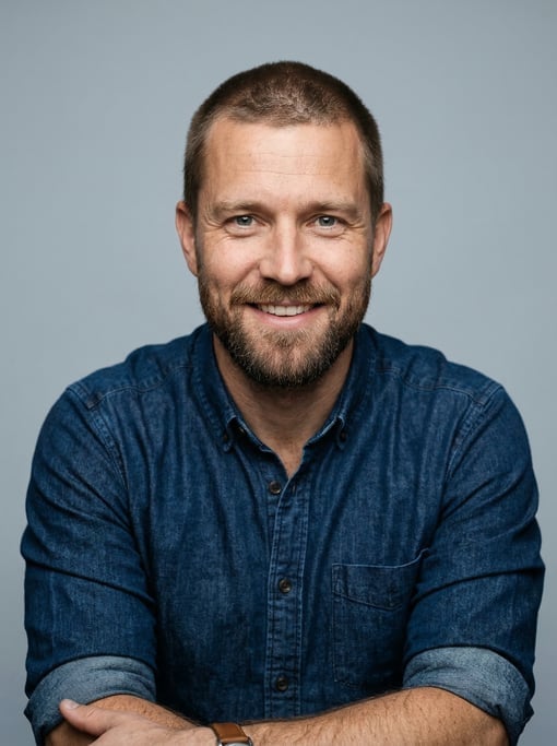 Professional studio headshot of a 38-year-old White Nordic man with a buzz cut in brown